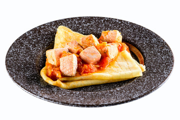 Delicious crepe with salmon and sauce isolated on white backgrou