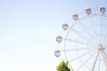 Ferris wheel on blue background