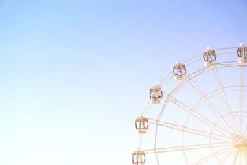 Ferris wheel on blue background