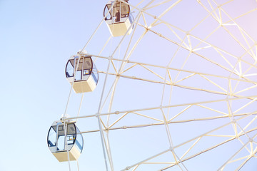 Ferris wheel on blue background