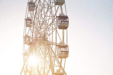 Ferris wheel on blue background