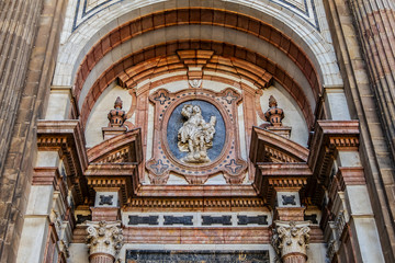 Obraz premium Architectural fragments of Malaga Cathedral façade. Renaissance Cathedral - Roman Catholic Church in the city of Malaga, was constructed between 1528 and 1782. Malaga, Costa del Sol, Andalusia, Spain.