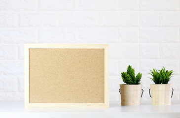 mock up Blank Cork board with Watch,Green plants on white brick wall,minimal style