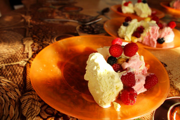 Ice cream with berries on the table