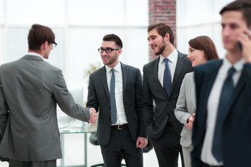 Fototapeta premium Confident young people, handshake and smile