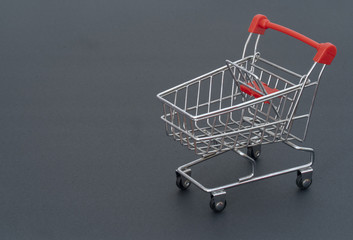 Shopping cart on gray background