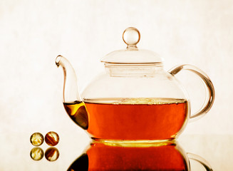 tea pot with tea and cup