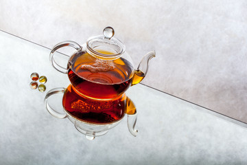 tea pot with tea and cup