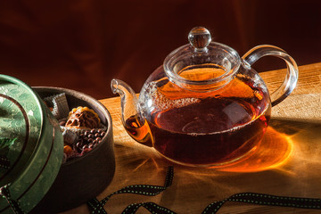 tea pot with tea and cup