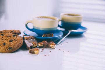 hot coffee, chocolate and cookies in morning