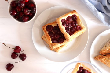 Freshly baked puff pastry with cherries