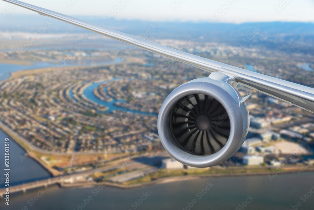 Wall mural airplane engine above the of redwood shores state marine park and foster city. san francisco. califo