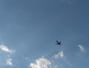 Airplane in blue sky. Background