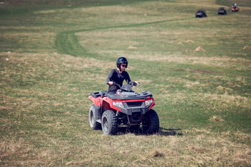 man riding atv vehicle on off road track ,people outdoor sport activitiies theme