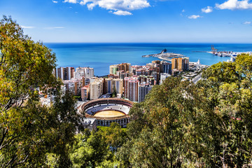 Beautiful aerial view on the Malaga with Plaza de Toros (Bullring, 1874) from Gibralfaro Castle on a sunny day. Malaga, Costa del Sol, Andalusia, Spain.