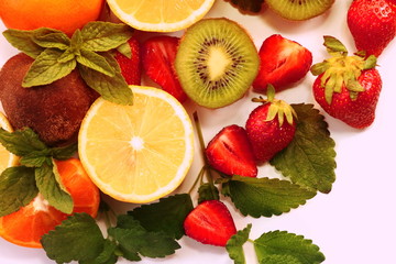 citrus fruits and strawberries on white background
