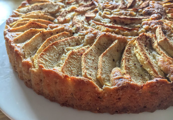 An apple pie. Slised apple with sugar and cinnamon at the top. close up.