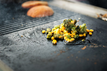 The process of cooking rice with vegetables. Asian cuisine. Street food.