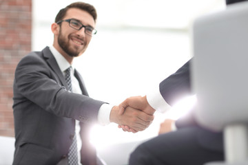 Fototapeta premium Close up of business handshake in the office