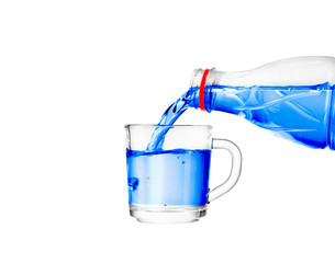 pouring water into a glass on a white background