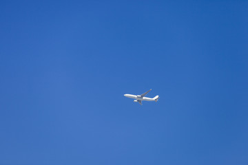 Fototapeta na wymiar Aeroplane Flying Far Above
