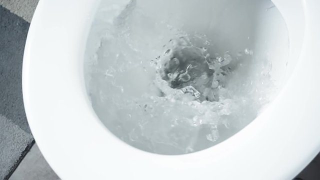 Detail of toilet flushing slow motion