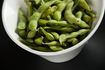 Green Edamame in a white bowl