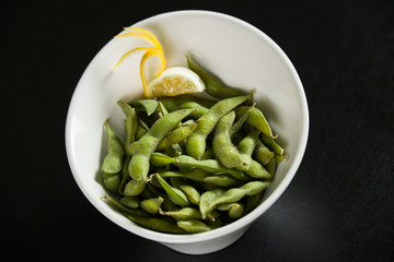 Green Edamame in a white bowl