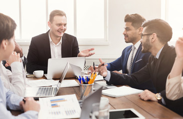 Young team discussing project in modern office