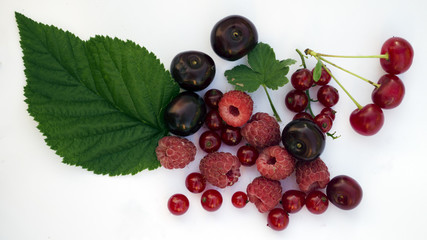 Top view. Various fresh summer berries on white background