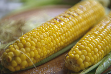 Beautiful corn grilled with salt on a kitchen board