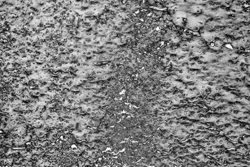 Wall fragment with scratches and cracks