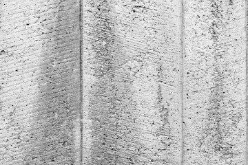 Wall fragment with scratches and cracks