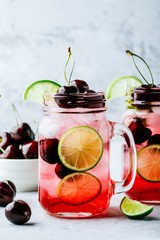 Cherry Limeade or Lemonade in glass mason jar. Ice cold summer drink.