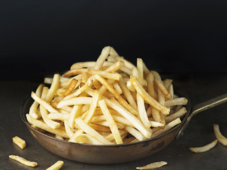 pan of rustic golden french fries