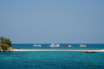the floating boat on the beach has a beach front