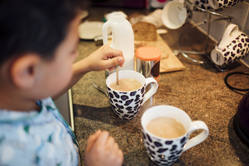 Little Boy Mixing Tea