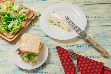Vegetarian sandwich with salad and blue cheese on a wooden background. Healthy Diet