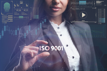 The concept of business, technology, the Internet and the network. A young entrepreneur working on a virtual screen of the future and sees the inscription: ISO 9001