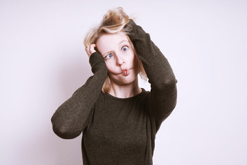 silly young woman kidding around and grimacing cross-eyed