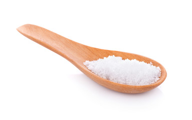 Fototapeta na wymiar Sea salt in wooden spoon on white background