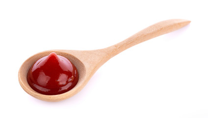 tomato sauce isolated in spoon on white background