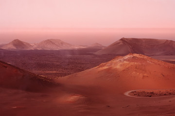 mountains and hills during dust sand storm. Mars red planet imitation. Marsian landscape. Toned