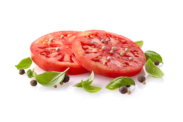 Tomato with basil leaves