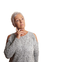 thoughtful concerned mature woman looking up. isolated on white.