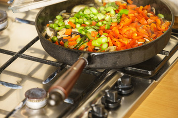 Chopped vegetables on frying pan