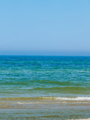 Blue sea water horizon and sky.