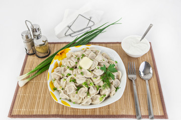 Russian dumplings with herbs and onions.