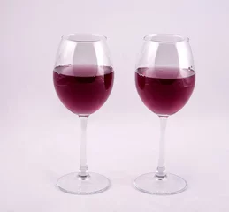 Fotobehang two glasses of red wine on white background © tashas