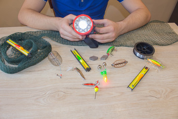 bait, wobbler and fishing accessories on the table